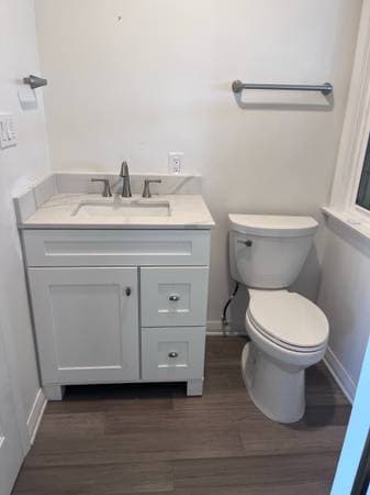 picture of a newly remodeled bathroom with new sink vanity and toilet and flooring