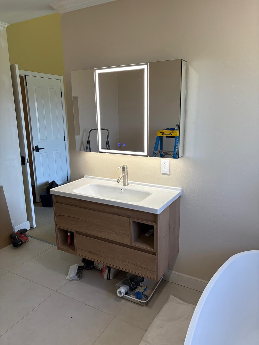 picture of newly remodeled kitchen bathroom with bathroom lights and fixtures