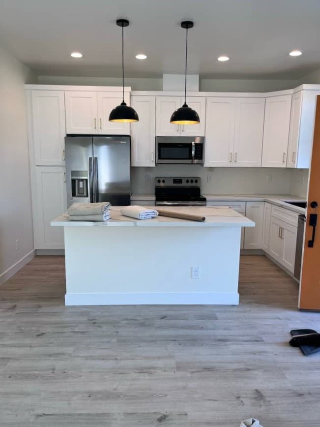 picture of newly remodeled kitchen with custom lights and cabinets